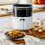 Camry CR 6313 Air Fryer Oven in use, cooking potato wedges