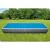 Intex rectangular pool with solar cover in garden setting