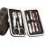 Manicure and pedicure set with 7 tools in a brown checkered case