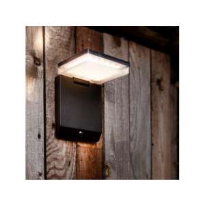 LUTEC MOZE kültéri LED fali lámpa megvilágít egy fa kerítést, mozgásérzékelő - Lutec