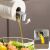 Flippy oil dispenser pouring oil on salad, automatic gravity induction, 550ml
