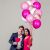 Couple celebrating with KipHome pink and confetti balloons