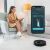Woman using Cecotec Conga 7490 Ultimate Genesis robot vacuum app