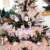 Close-up of Springos Ct0174 90 cm Artificial Spruce Christmas Tree decorated with pink feathers and ornaments