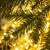Close-up of Springos® Artificial Spruce Christmas Tree branches with lights