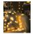 StarLight Christmas String Lights with star shaped LEDs decorating a pillow