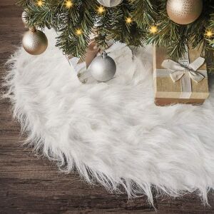 White faux fur Christmas tree skirt under decorated tree - Christmas tree stand