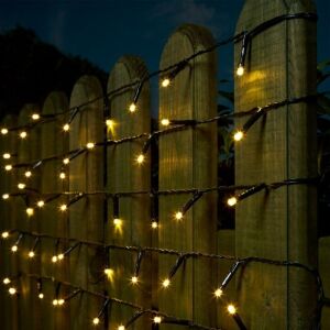 Flippy 200 LED warm white string lights decorating a wooden fence - Christmas