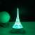 Flippy 3D Eiffel Tower LED lamp with remote control, showing the green light option