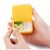 Flippy yellow two-compartment pill organizer held in hands, open view