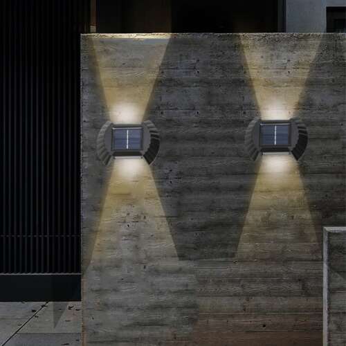 Flippy solar wall lights installed on a wall, illuminating the area with warm white light