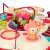 Close-up of Ikonka Interactive Baby Game Table - Red, carousel and monkey details