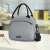 Tasty Food lunch bag on a kitchen counter, grey insulated lunch bag with shoulder strap