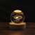 Flippy Galaxy 3D Crystal Ball LED Night Light on a wooden base, illuminated