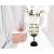 Flippy wine glass shaped LED table lamp with warm white light on a white background