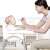 Baby sitting in Pepita 2in1 fix high chair with removable tray, white