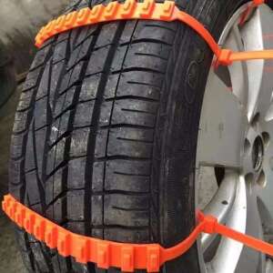 Orange plastic snow chains for car tires, providing better grip on slippery roads - Snow Chain