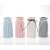 Set of 4 ceramic vases in blue, pink, white, and gray with white string