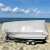 Gardlov silver tarp covering a boat on the beach, boat cover