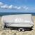 Gardlov silver tarp covering a boat on the beach, boat cover