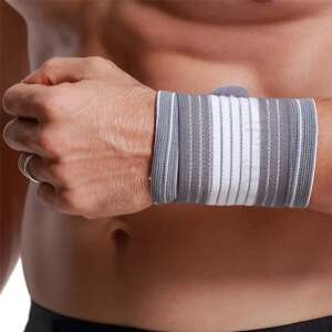 Man wearing a grey and white wrist support brace,  <product_name> elastic wrist brace with compression sleeve and adjustable velcro closure, unisex, one size, white/grey - Everyday joint fixation