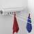 Retractable clothesline with 4 lines, 14 meters of drying space, white, mounted on wall, with towels hanging