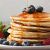 Stack of pancakes with blueberries and syrup