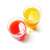Two glasses of freshly squeezed juice, one orange and one red