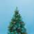 Christmas tree with Home by Somogyi turquoise LED string lights
