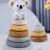 Koala toy sitting on stacking rings for baby