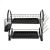 Two-tier black dish rack with cutlery and glass holder on white background