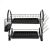 Two-tier black dish rack with cutlery and glass holder on white background