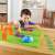 Child playing with STEM Learning Resources Code & Go Robot Mouse Activity Set, building a maze and programming the robot mouse