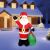 Inflatable Santa Decoration with LED lights in front of house at night