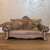Purlov cat scratching sofa, beige, with cat
