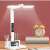 White LED desk lamp with built-in battery, date, time, and temperature display, adjustable lighting angle, phone holder, and pen holder on a desk