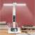 White LED desk lamp with built-in battery, date, time, and temperature display, adjustable lighting angle, phone holder, and pen holder, on a desk with other items