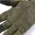 Close-up of the palm of green tactical gloves with touchscreen capability, L size