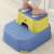Child standing on Linomag® 2 in 1 two-step stool, multi-functional, for toilet, bathroom and kitchen, light blue / yellow
