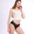 Woman wearing black period underwear with geometric lace waistband, XS size