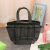 Gray mesh shower caddy tote bag with multiple pockets in bathroom setting
