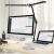 IZOXIS adjustable desk lamp with clamp illuminating desk setup with computer and laptop