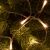 Home by Somogyi warm white LED string lights decorating a Christmas tree