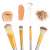 Close-up of 4 makeup brushes from the 24 piece professional makeup brush set, silver and gold handles, synthetic bristles, various shapes, ideal for professional makeup artists and beginners alike
