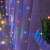 <product_name> 200 micro LED curtain lights hanging on a window, showing the curtain lights in a close-up view
