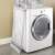 Timeless Tools electric clothes dryer with 8 drying rods, placed next to a washing machine