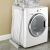 Timeless Tools Electric Clothes Dryer folded, next to washing machine