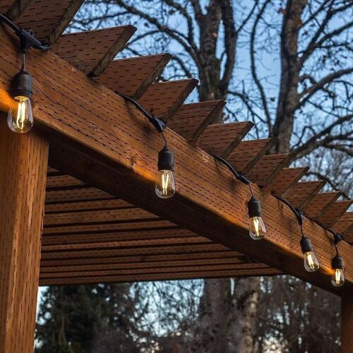 Outdoor LED String Lights illuminating a wooden pergola