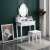 Pepita Vintage white dressing table with mirror and stool in bedroom setting
