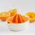 Fiskars Functional Form Citrus Juicer, orange and white, with oranges